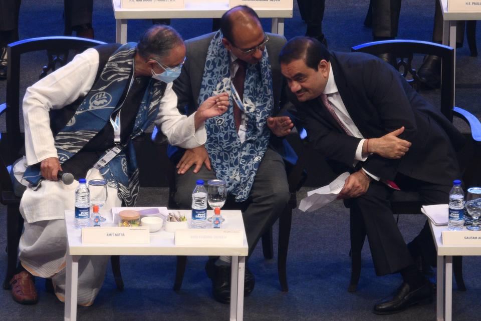 Gautam Adani (R) interacts Chief economic advisor Amit Mitra (L) during sixth edition of Bengal Global Business Summit (BGBS) with industrial stalwarts and representatives from 49 countries at Biswa Bangla Convention Centre, New Town on April 20, 2022 in Kolkata, India.