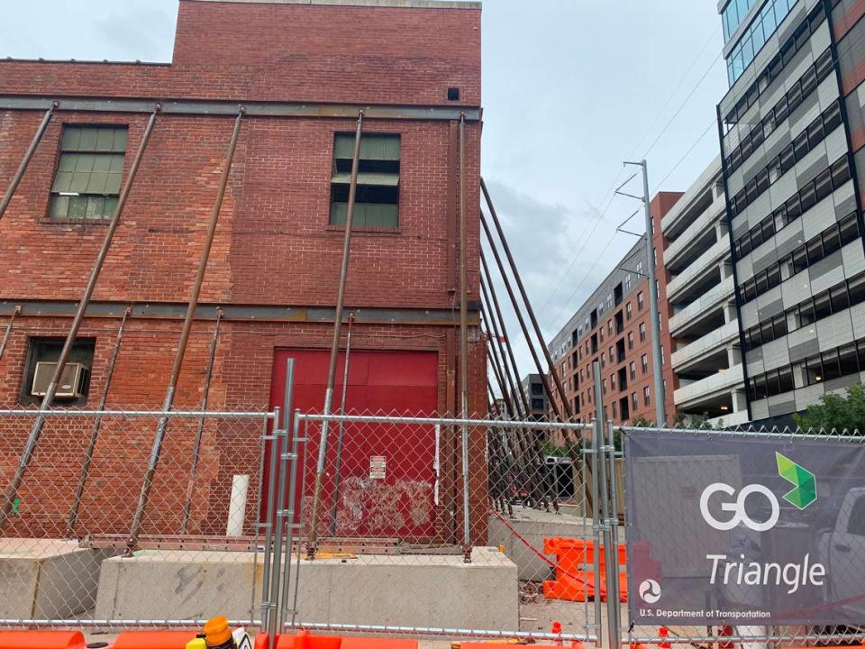 Workers have braced the walls of the former Dillon Supply Co. building on West Street in downtown Raleigh. The walls will be incorporated into Union West, a high-rise apartment complex being built next to Raleigh Union Station.