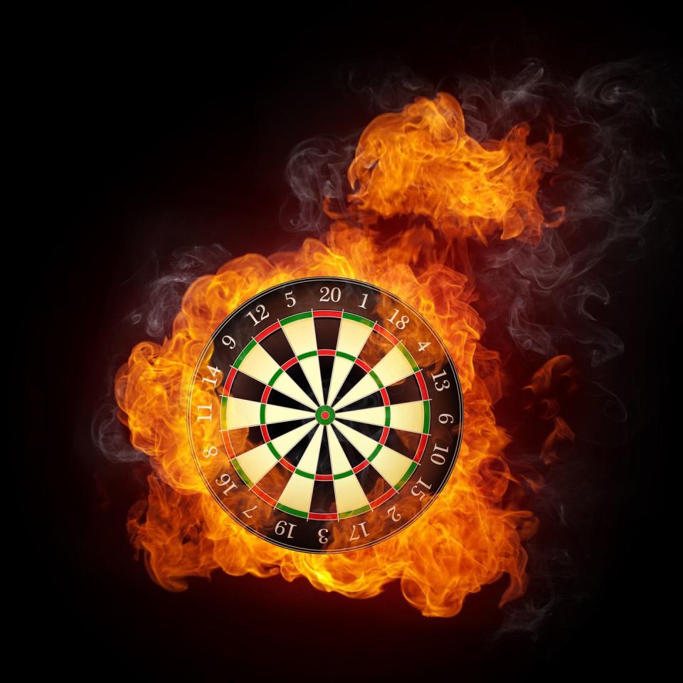 darts board in fire isolated on black background