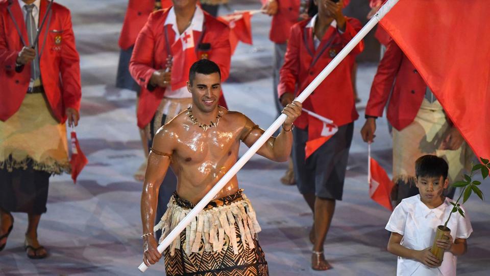 <p>Taufatofua <a href="https://people.com/sports/shirtless-tonga-flag-bearer-at-olympic-opening-ceremony/" rel="nofollow noopener" target="_blank" data-ylk="slk:first went viral;elm:context_link;itc:0;sec:content-canvas" class="link ">first went viral</a> for his shirtless, oiled-up look at the 2016 Olympics. (Ah, 2016, a simpler time!)</p>