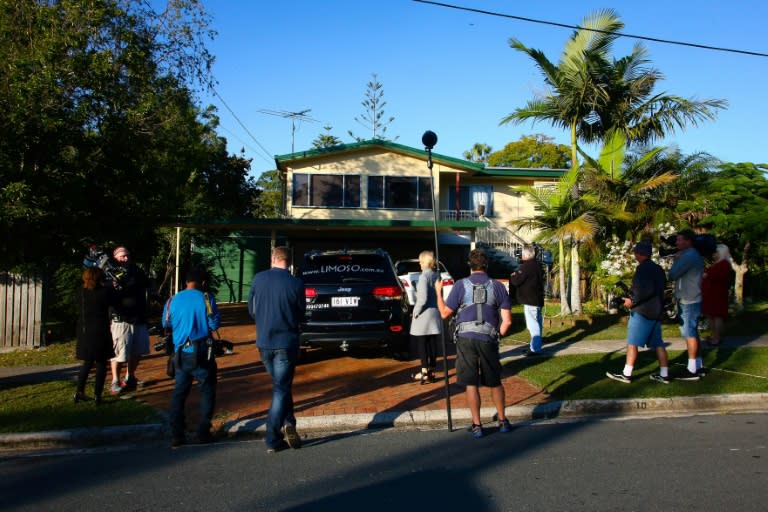 Members of the media stand outside Schapelle Corby's mother's home south of Brisbane, awaiting the return of the Australian from Bali 12 years after her conviction for drug trafficking