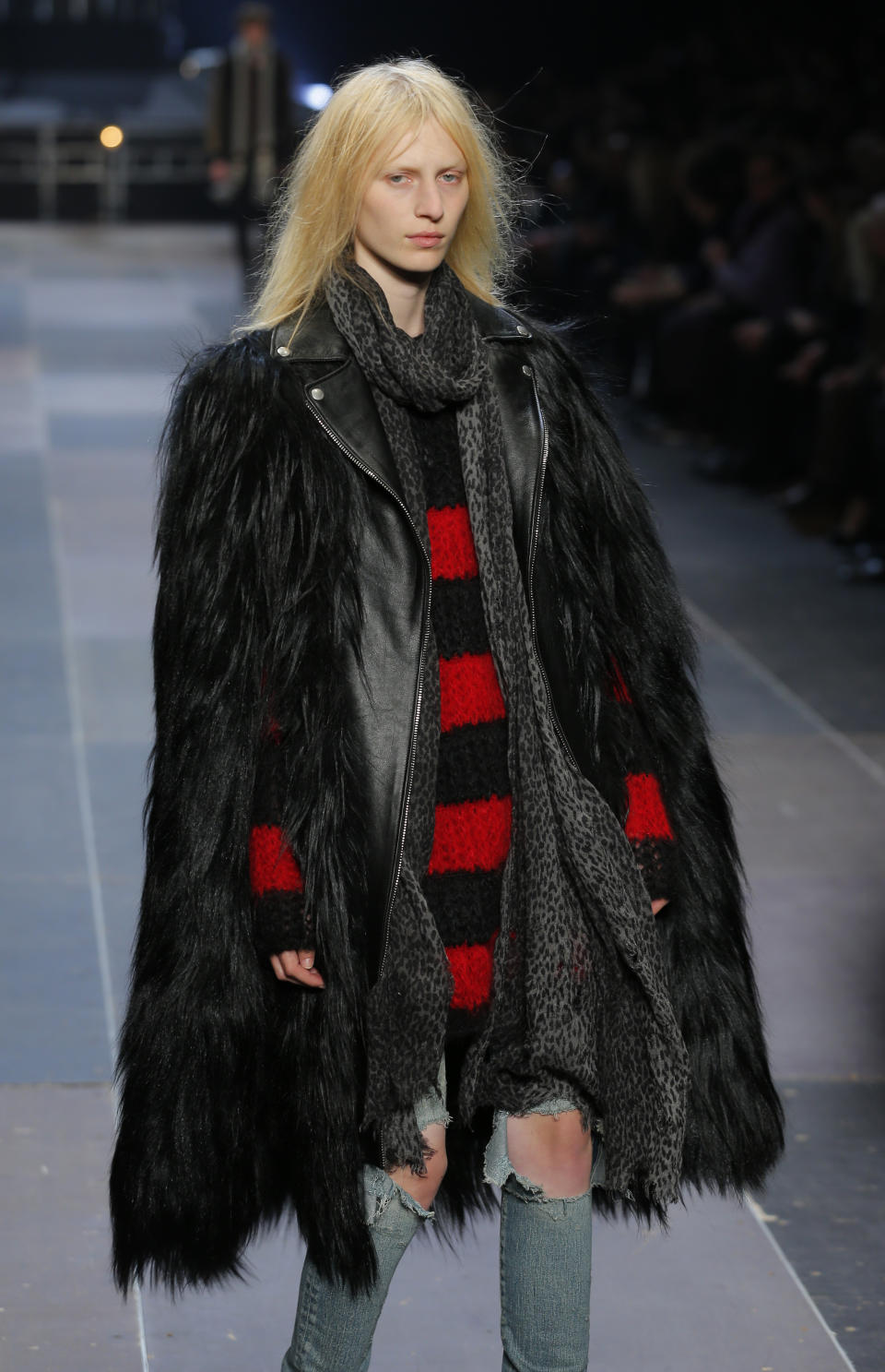 A model wears a creation by Born French fashion designer Hedi Slimane for St Laurent as part of the Men's fall-winter 2013-2014 fashion collection presented in Paris, Sunday , Jan. 20 2013 (AP Photo/ Jacques Brinon)