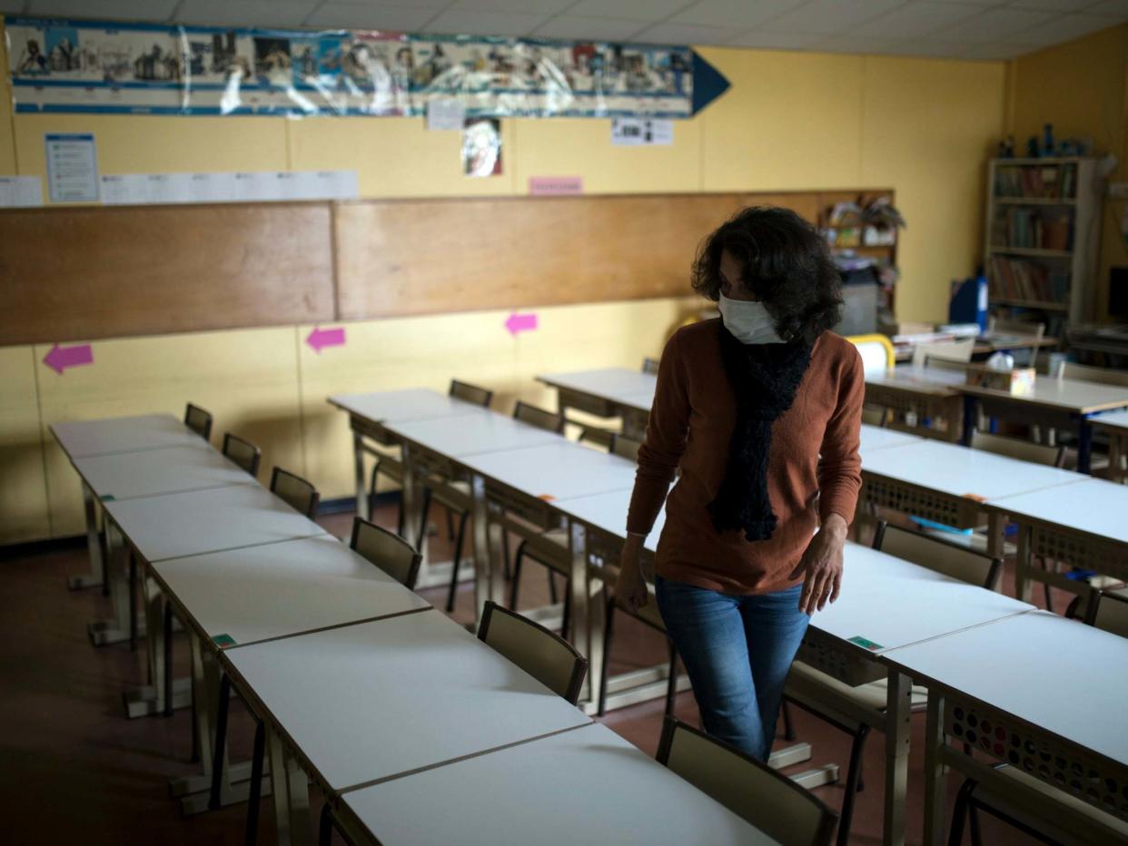 Primary school teacher prepares a classroom to receive students on a voluntary basis at the Saint-Tronc Castelroc primary school in Marseille, southern France, 11 May 2020: AP