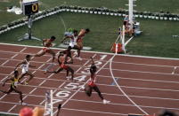 <p>Carl Lewis won four gold medals in the 4x100-meter, 100-meter, 200-meter, and long jump events. However, Mary Lou Retton, on an injured knee, became the star of the games after winning gold in the all-around, which capped a five-medal performance.</p><p><a rel="nofollow noopener" href="http://www.goodhousekeeping.com/life/inspirational-stories/a38681/family-eating-disorder/" target="_blank" data-ylk="slk:Read more inspiring stories on Good Housekeeping.;elm:context_link;itc:0;sec:content-canvas" class="link "><em>Read more inspiring stories on Good Housekeeping.</em></a></p>