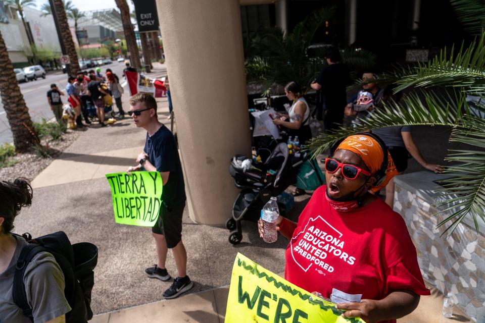 During a protest outside the Sheraton Phoenix Downtown hotel, ahead of Phoenix Mayor Kate Gallego's State of the City address, in Phoenix on April 12, 2023.