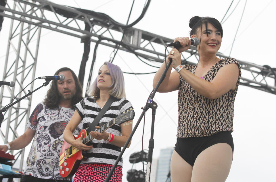 FILE - The Julie Ruin, with Kathleen Hanna, from right, Sara Landeau, and Kenny Mellman, performs during Fun Fun Fun Fest in Austin, Texas on Nov. 10, 2013. Hanna released a memoir "Rebel Girl: My Life as a Feminist Punk." (Photo by Jack Plunkett/Invision/AP, File)