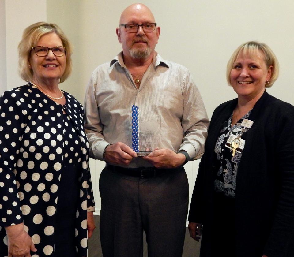 Luellen Deeds, volunteer coordinator, left and Wendy Elliott, president and CEO of Southeastern Med, are shown with Bill Schuman, who was recently recognized as Volunteer of the Year for 2021 by Southeastern Med.