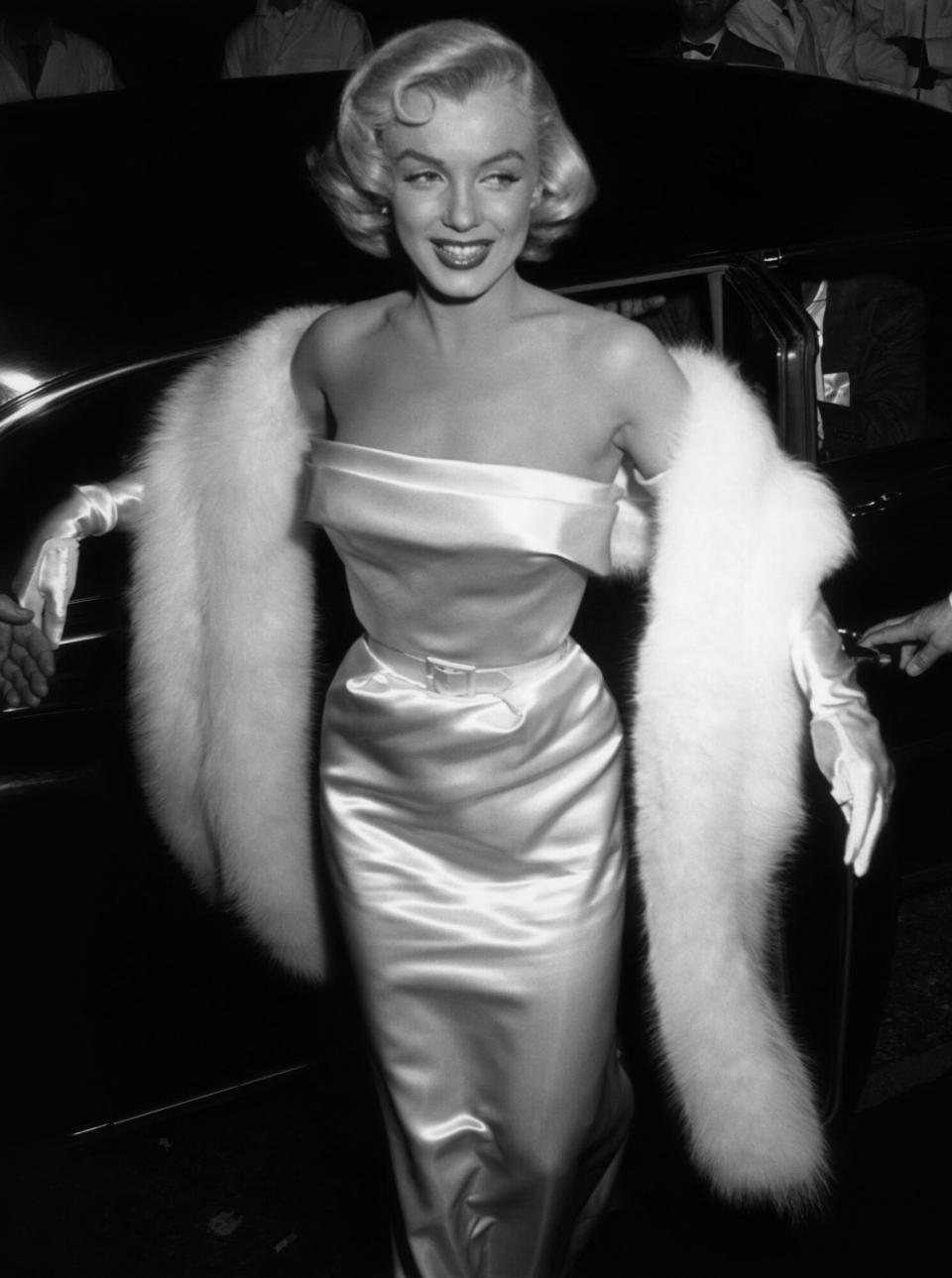 Marilyn Monroe (1926 - 1962) arriving at the premiere of the film 'There's No Business like Show Business'