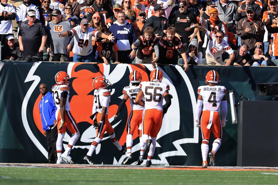 Cleveland Browns' Denzel Ward (21) celebrates an interception for a touchdown during the first half of an NFL football game against the Cincinnati Bengals, Sunday, Nov. 7, 2021, in Cincinnati. (AP Photo/Aaron Doster)