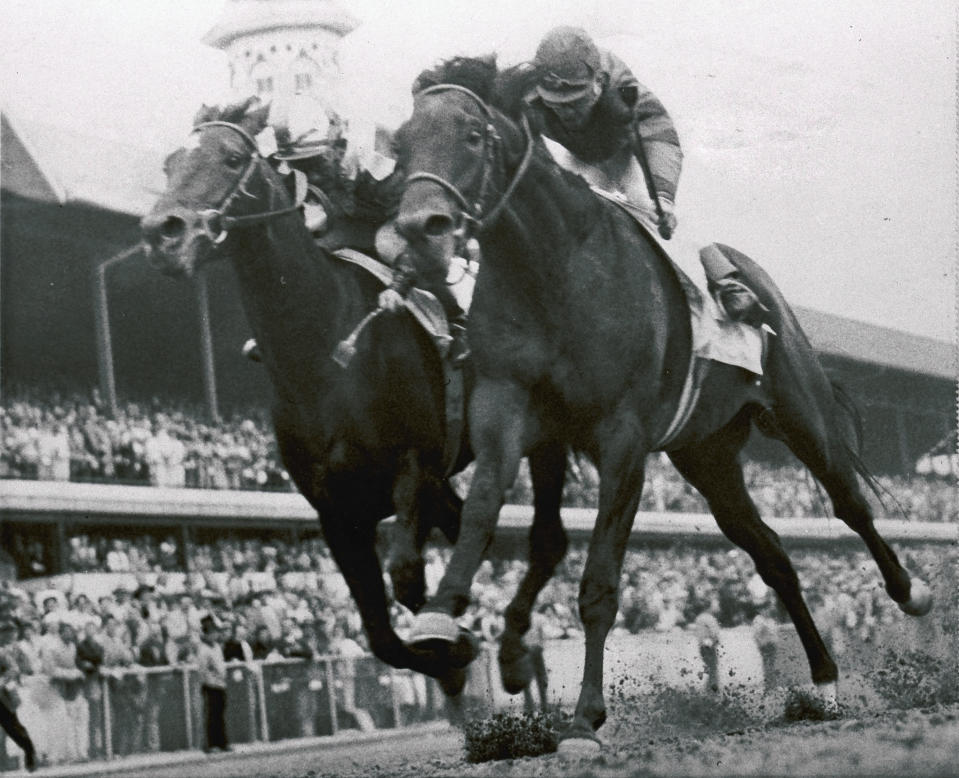 FILE - Iron Liege, right, Bill Hartack up, edges out Gallant Man, Bill Shoemaker up, at the finish line to win the Kentucky Derby horse race at Churchill Downs in Louisville, Ky., May 4, 1957. One of the Derby's most infamous moments occurred in the stretch run. Bill Shoemaker, aboard Gallant Man, was challenging leader Iron Liege and Bill Hartack when Shoemaker misjudged the finish line. He stood in the saddle momentarily at the sixteenth-pole, but it was long enough to ruin Gallant Man's momentum and propel Iron Liege to a nose victory. (AP Photo/File)