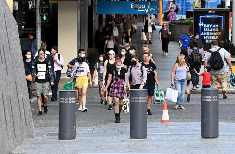 BRISBANE, AUSTRALIA - MARCH 29: People are seen wearing face masks on the Queen Street Mall in the Brisbane CBD after Queensland Premier Annastacia Palazczuk announced a three-day lockdown for the Greater Brisbane area, effective as of 5 pm on Monday. The lockdown measures for Ipswich, Logan, Redlands, Moreton and Brisbane council areas come as four new community COVID-19 cases were confirmed overnight, on March 29, 2021 in Brisbane, Australia. (Photo by Bradley Kanaris/Getty Images)