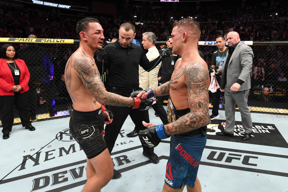 ATLANTA, GA - APRIL 13:  (L-R) Max Holloway and Dustin Poirier interact after Poirier defeated Holoway by unanimous decision in their interim lightweight championship bout during the UFC 236 event at State Farm Arena on April 13, 2019 in Atlanta, Georgia. (Photo by Josh Hedges/Zuffa LLC/Zuffa LLC via Getty Images)