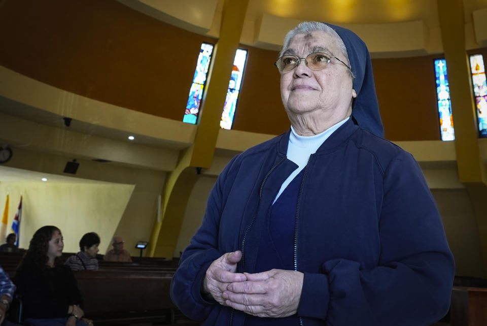 Sister Inés Espinoza waits for an Ash Wednesday Mass to begin at the Virgin of Charity shrine, known as La Ermita, in Miami, Florida, Wednesday, Feb. 14, 2024. The Havana native and member of the Daughters of Charity order, which was expelled from Cuba in 1972, ministers to the material and spiritual needs of growing numbers of migrants from across Latin America, including Cuba, who make the Ermita their first stop. (AP Photo/Marta Lavandier)