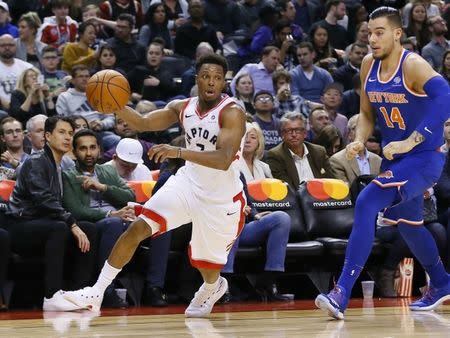 Nov 17, 2017; Toronto, Ontario, CAN; Toronto Raptors guard Kyle Lowry (7) gets around New York Knicks center Willy Hernangomez (14) at the Air Canada Centre. Mandatory Credit: John E. Sokolowski-USA TODAY Sports