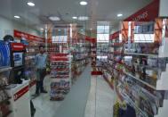 A worker stands inside a convenience store at the Fortis Memorial Hospital at Gurgaon on the outskirts of New Delhi, India, May 20, 2015. REUTERS/Anindito Mukherjee