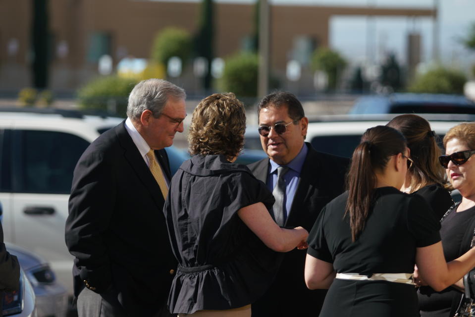 El Paso mayor Dee Margo, left, speaks to the family of Andre Anchondo, prior to the funeral services of Jordan Anchondo at San Jose Funeral Homes in El Paso, Texas on Saturday, Aug. 10, 2019. Andre and Jordan Anchondo, were among the several people killed last Saturday, when a gunman opened fire inside a Walmart packed with shoppers. Authorities say Jordan Anchondo was shielding the baby, while her husband shielded them both. (AP Photo/Jorge Salgado)