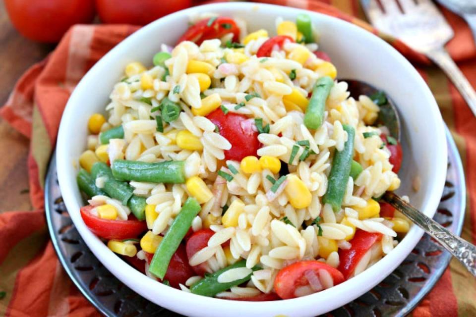 <p>Recipe Girl</p><p>Highlight the best of summer produce.</p><p><strong>Get the recipe:</strong> <strong><a href="http://www.recipegirl.com/2007/03/29/orzo-salad-with-corn-green-beans-and-tomatoes/" rel="nofollow noopener" target="_blank" data-ylk="slk:Orzo Pasta Salad with Corn, Green Beans and Tomatoes;elm:context_link;itc:0;sec:content-canvas" class="link ">Orzo Pasta Salad with Corn, Green Beans and Tomatoes</a></strong></p><p><strong>Related: <a href="https://parade.com/1292137/parade/corn-recipes/" rel="nofollow noopener" target="_blank" data-ylk="slk:100 Best Corn Recipes with Canned, Frozen and Fresh;elm:context_link;itc:0;sec:content-canvas" class="link ">100 Best Corn Recipes with Canned, Frozen and Fresh</a></strong></p>