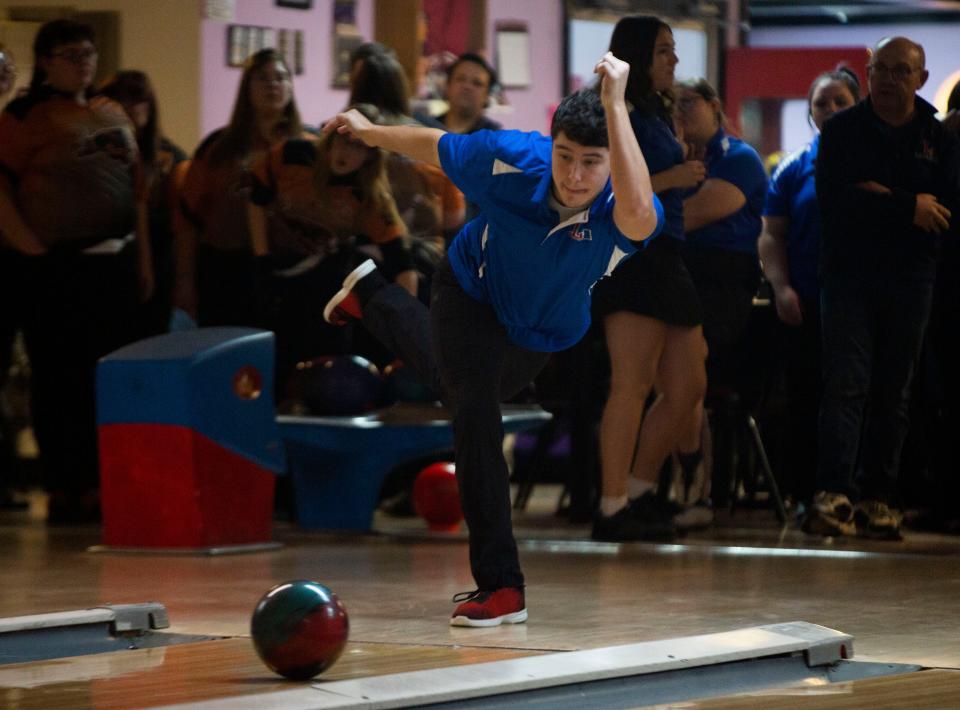 Lakewood junior Stewart Poulnott throws the ball down the lane as Lakewood hosted New Lexington in a bowling match up at Village Lanes in Thornville, Ohio on January 27, 2022.