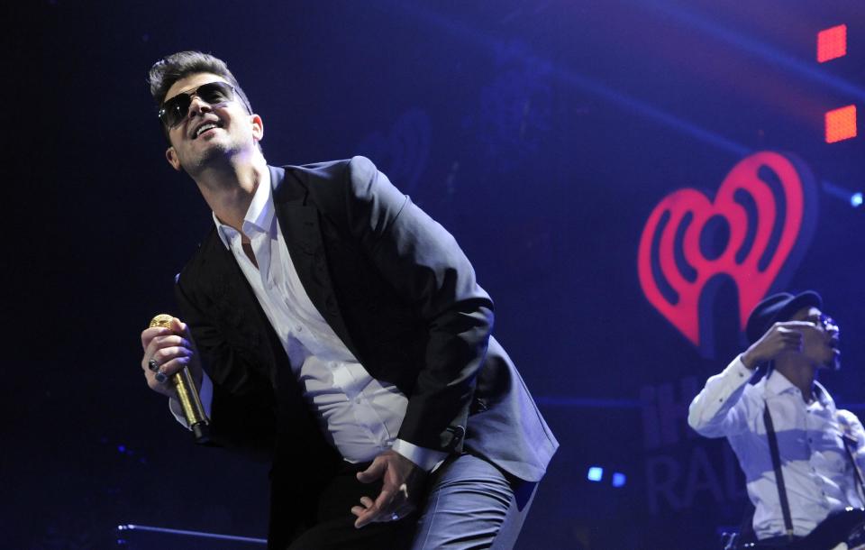 FILE - In this Friday, Dec. 6, 2013 file photo, Robin Thicke performs during the KIIS-FM Jingle Ball concert at Staples Center in Los Angeles. Thicke has been making impressive music for more than a decade, but it’s nice to see him achieve his pop success with “Blurred Lines.” (Photo by Chris Pizzello/Invision/AP, File)