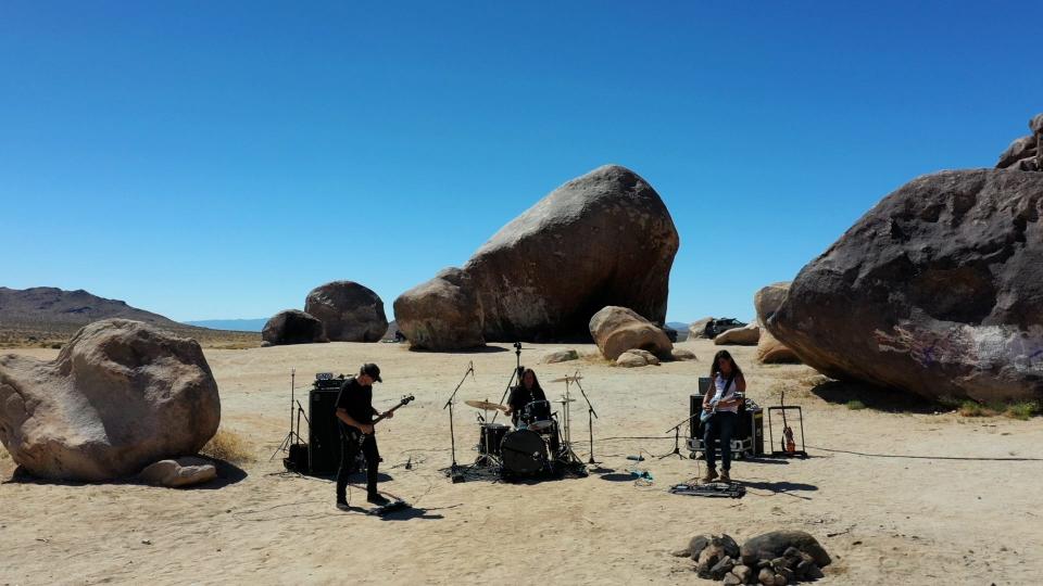 A still from "Live at Giant Rock." Mario Lalli (left), Bill Stinson (center) and Gary Arce (right) of the local band Yawning Man recorded a live set at Giant Rock outside Landers, Calif. in May.