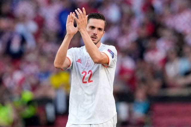 Spain’s Pablo Sarabia applauds as he leaves the pitch