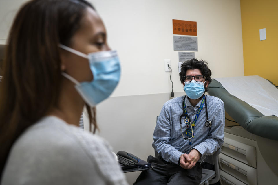 Dr. Matthew Kusher, clinical director of Plaza del Sol Family Health Center checks a patient at the Plaza Del Sol Family Health Center in the Queens borough in New York, Thursday, Jan. 11, 2024. (AP Photo/Eduardo Munoz Alvarez)