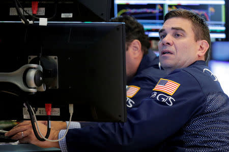 Traders work on the floor of the New York Stock Exchange (NYSE) in New York City, U.S., July 21, 2016. REUTERS/Brendan McDermid