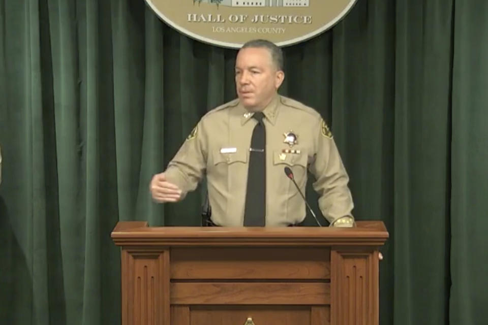 In this image take from a livestream video feed provided by the Los Angeles County Sheriff's Department, Sheriff Alex Villanueva speaks during a news conference in Los Angeles, Wednesday, April 7, 2021, about the Tiger Woods' accident. Authorities say Woods was speeding when he crashed an SUV in Southern California less than two months ago, leaving him seriously injured. (Los Angeles County Sheriff's Department via AP)