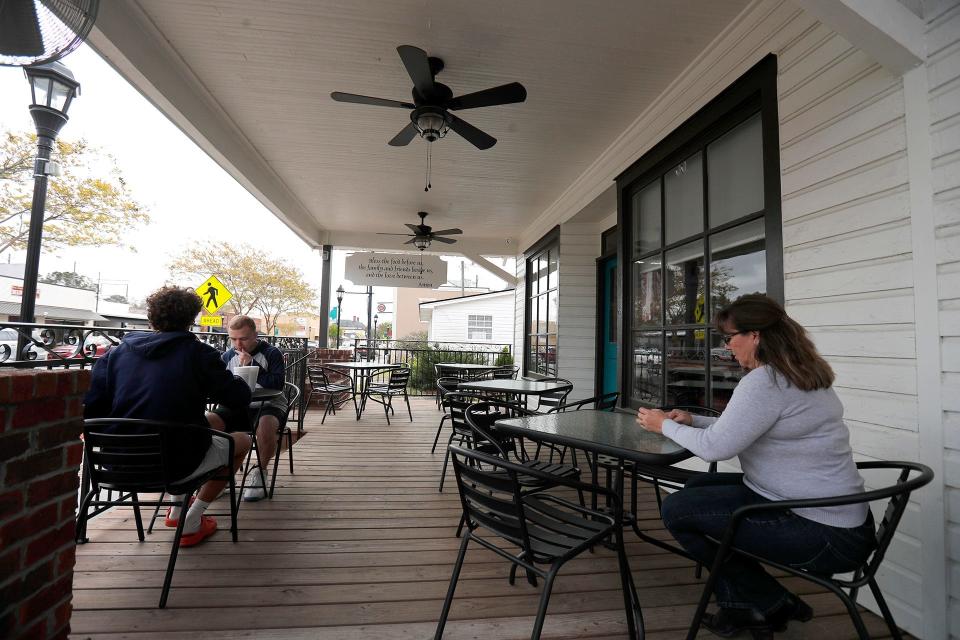 Customers relax in the outdoor seating area at Central Station in Springfield.