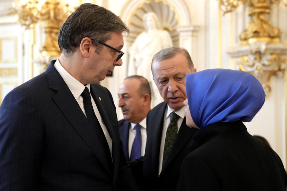 Turkey's President Recep Tayyip Erdogan, center, speaks with Serbia's President Aleksandar Vucic, left, during a meeting of the European Political Community at Prague Castle in Prague, Czech Republic, Thursday, Oct 6, 2022. Leaders from around 44 countries are gathering Thursday to launch a "European Political Community" aimed at boosting security and economic prosperity across the continent, with Russia the one major European power not invited. (AP Photo/Darko Bandic)