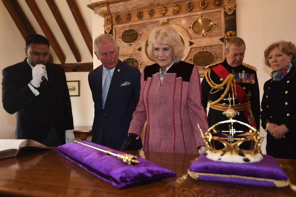 Britain's Prince Charles, Prince of Wales and Britain's Camilla, Duchess of Cornwall gesture during their visit to The Tower of London, central London on February 13, 2020, to mark 535 years since the creation of the  (Beefeaters) and to celebrate 50 years of the British Tourist Authority. (Photo by Eddie MULHOLLAND / POOL / AFP) (Photo by EDDIE MULHOLLAND/POOL/AFP via Getty Images)