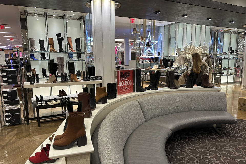 Black Friday shoppers look through merchandise at Macy's in Herald Square on Friday, Nov. 24, 2023, in New York. (AP Photo/Anne D'Innocenzio)