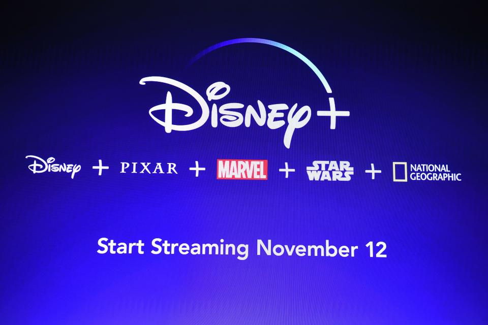 A screen announcing the Disney+ streaming service is seen at the D23 Expo, billed as the "largest Disney fan event in the world," on August 23, 2019 at the Anaheim Convention Center in Anaheim, California. - Disney Plus will launch on November 12 and will compete with out streaming services such as Netflix, Amazon, HBO Now and soon Apple TV Plus. (Photo by Robyn Beck / AFP)        (Photo credit should read ROBYN BECK/AFP/Getty Images)