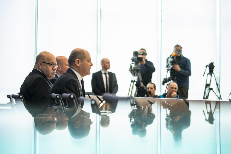 German Finance Minister Olaf Scholz (C) and German Economy Minister Peter Altmeier (L) attend a press conference to announce measures to contrast the economic consequences of the Coronavirus crise at the Bundespressekonferenz in Berlin, Germany on Marsch 13, 2020. (Photo by Emmanuele Contini/NurPhoto via Getty Images)