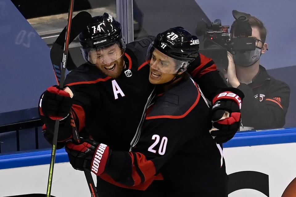 Carolina Hurricanes defenceman Jaccob Slavin (74) celebrates his goal against the New York Rangers with teammate Sebastian Aho (20) during the first period in the NHL hockey Stanley Cup playoffs in Toronto, Saturday, Aug. 1, 2020.