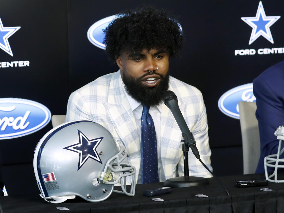 Dallas Cowboys running back Ezekiel Elliott speaks about his new contract during a news conference at the team's NFL football team's practice facility in Frisco, Texas, Thursday, Sept. 5, 2019. Elliott's agreement on a new contract ended a holdout that covered all of training camp and the preseason and came four days before the season opener at home against the New York Giants. (AP Photo/Tony Gutierrez)