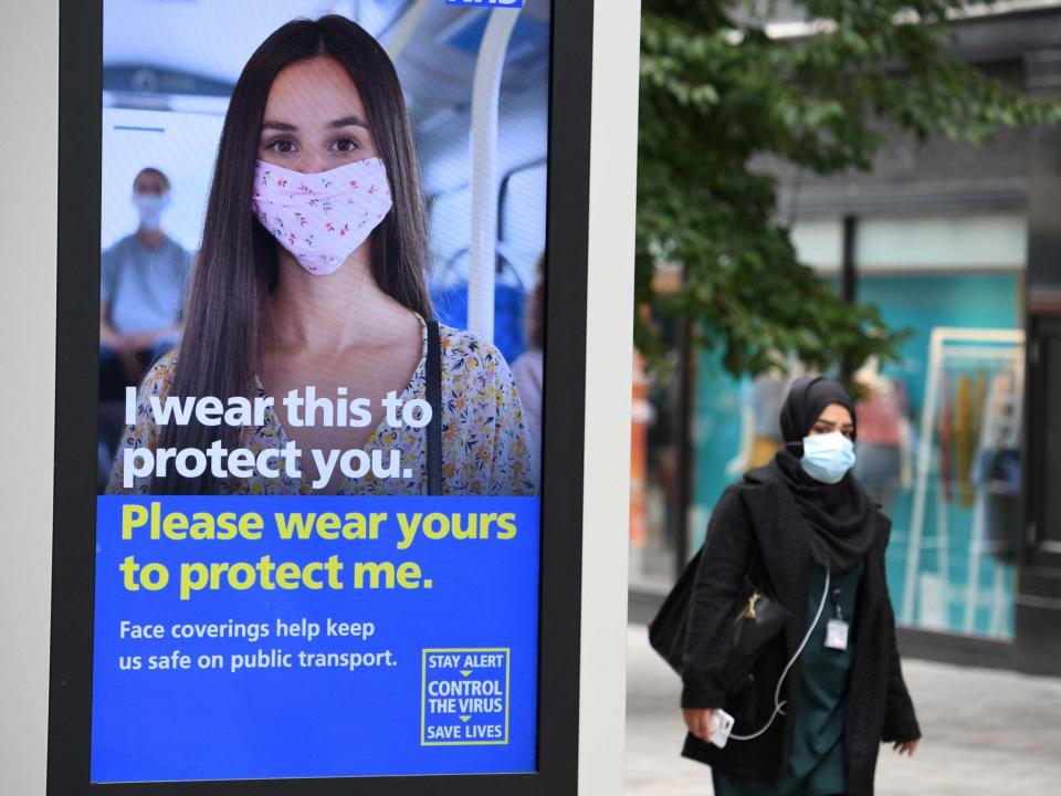 A pedestrian wears a facemask in the city centre of Leeds: AFP via Getty Images