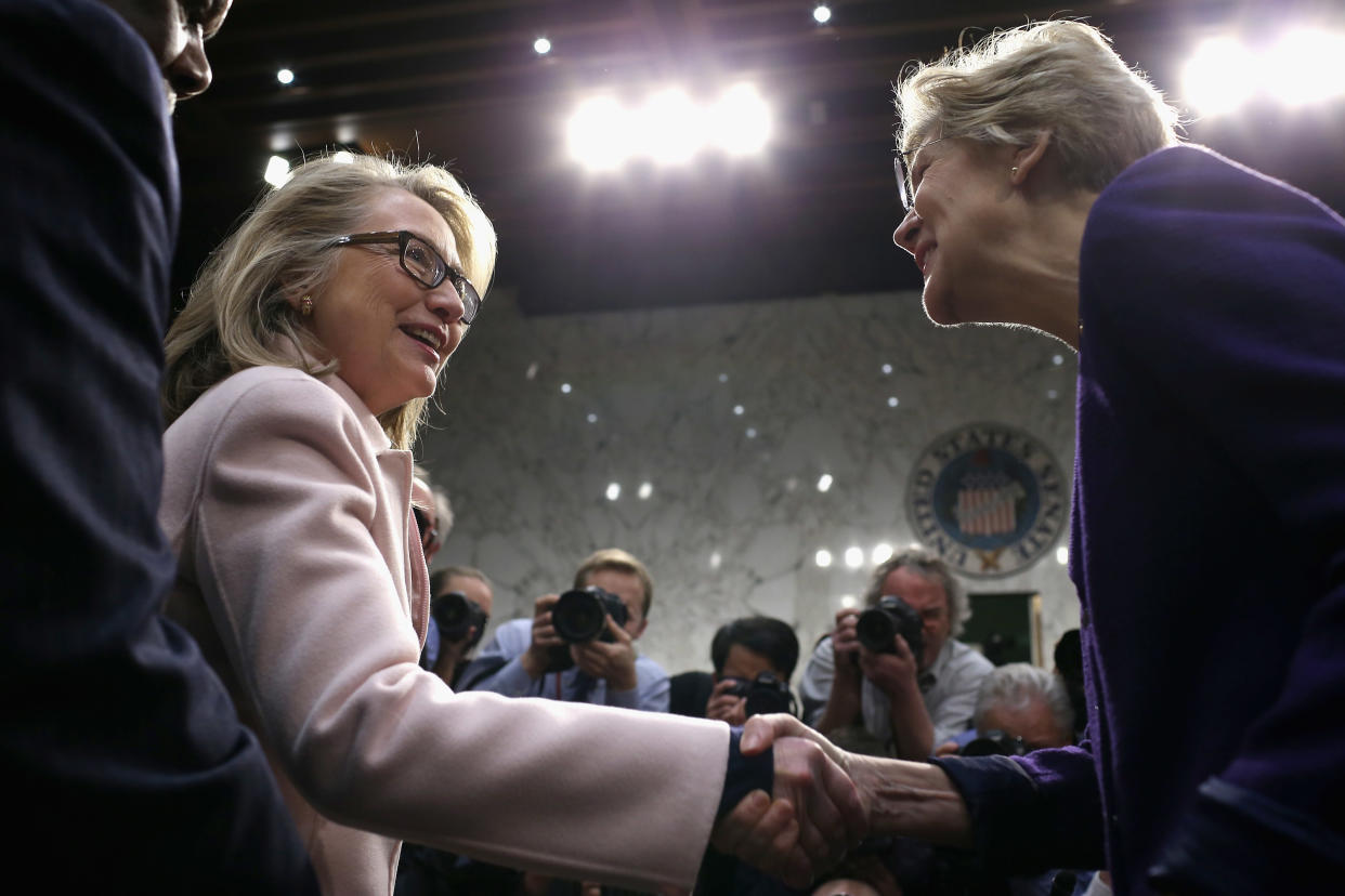 WASHINGTON, DC - JANUARY 24:  U.S. Secretary of State Hillary Clinton (L) greets Sen. Elizabeth Warren (D-MA) as they arrive for Sen. John Kerry's (D-MA) confirmation hearing before the Senate Foreign Relations Committee to become the next Secretary of State in the Hart Senate Office Building on Capitol Hill January 24, 2013 in Washington, DC. Nominated by President Barack Obama to succeed Hillary Clinton as Secretary of State, Kerry has served on this committee for 28 years and has been chairman for four of those years.  (Photo by Chip Somodevilla/Getty Images)