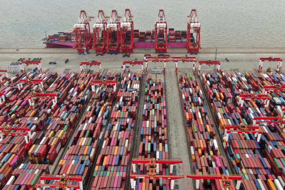 This aerial view shows the Yangshan container port in Shanghai, Saturday, July 10, 2021. China's exports surged in June while import growth slowed to a still-robust level as its economic rebound from the coronavirus leveled off. (Chinatopix Via AP)