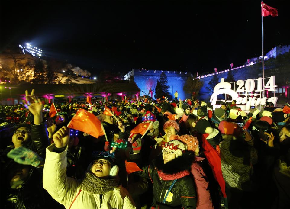 People celebrate the arrival of the new year during a new year's countdown event at the Badaling section of the Great Wall in Beijing January 1, 2014. REUTERS/Kim Kyung-Hoon (CHINA - Tags: SOCIETY ANNIVERSARY)