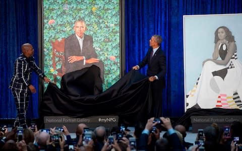 Barack Obama unveils his portrait alongside the portrait's artist, Kehinde Wiley