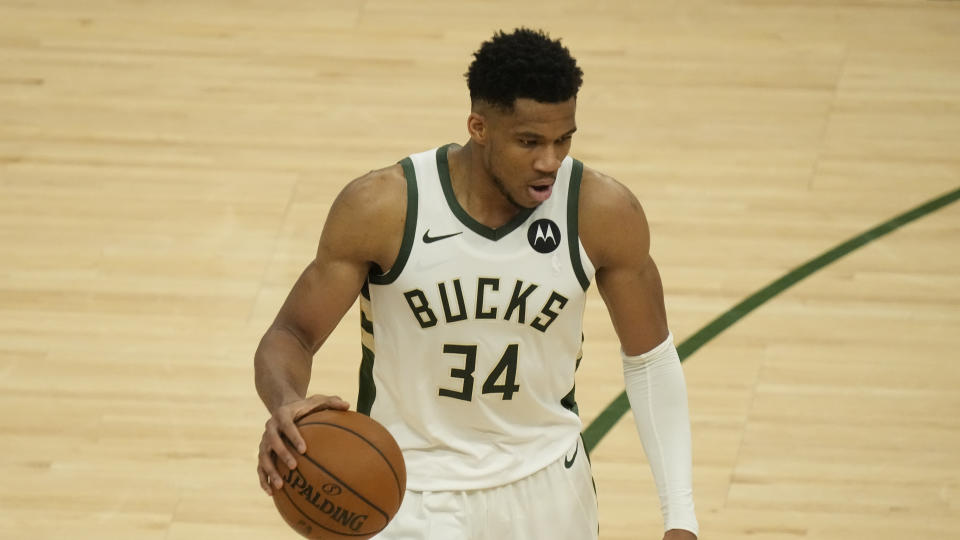 Milwaukee Bucks' Giannis Antetokounmpo dribbles during the first half of Game 2 of the NBA Eastern Conference basketball finals game against the Atlanta Hawks Friday, June 25, 2021, in Milwaukee. (AP Photo/Morry Gash)