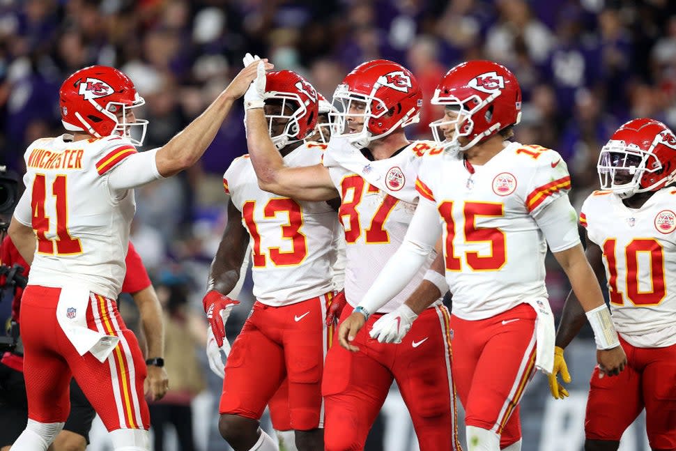 James winchester (#41) high fives Travis Kelce (#87) during a September 2021 Chiefs game