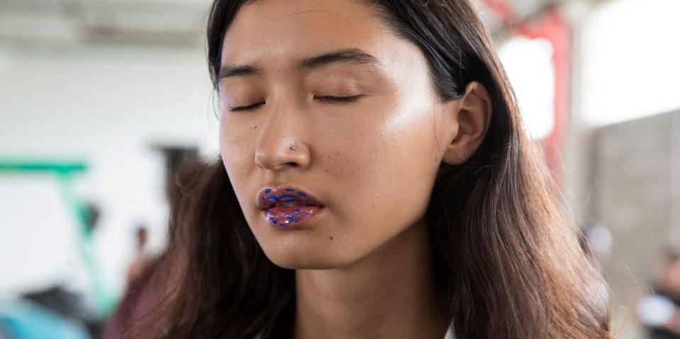 <p>Luckily you don't have to be a sculptor to nail Takase's marbleised lips. It's all about getting a thick glossy base, then streaking it with yellow, white or aquamarine.</p><p>First, apply more clear MAC Lipglass than you'd think humanly possible. Then add a bit more. Next, using a fine make-up brush dipped in watered-down Kryolan Aquacolor paint, brush on thin horizontal stripes in irregular shapes. The key is to let the paint merge into the lip gloss for a more organic look marble effect.</p><p><a rel="nofollow noopener" href="https://www.lookfantastic.com/mac-clear-lipglass-clear-15ml/11493157.html?" target="_blank" data-ylk="slk:SHOP NOW MAC Clear Lipglass - £15.50;elm:context_link;itc:0;sec:content-canvas" class="link ">SHOP NOW MAC Clear Lipglass - £15.50</a><br></p>