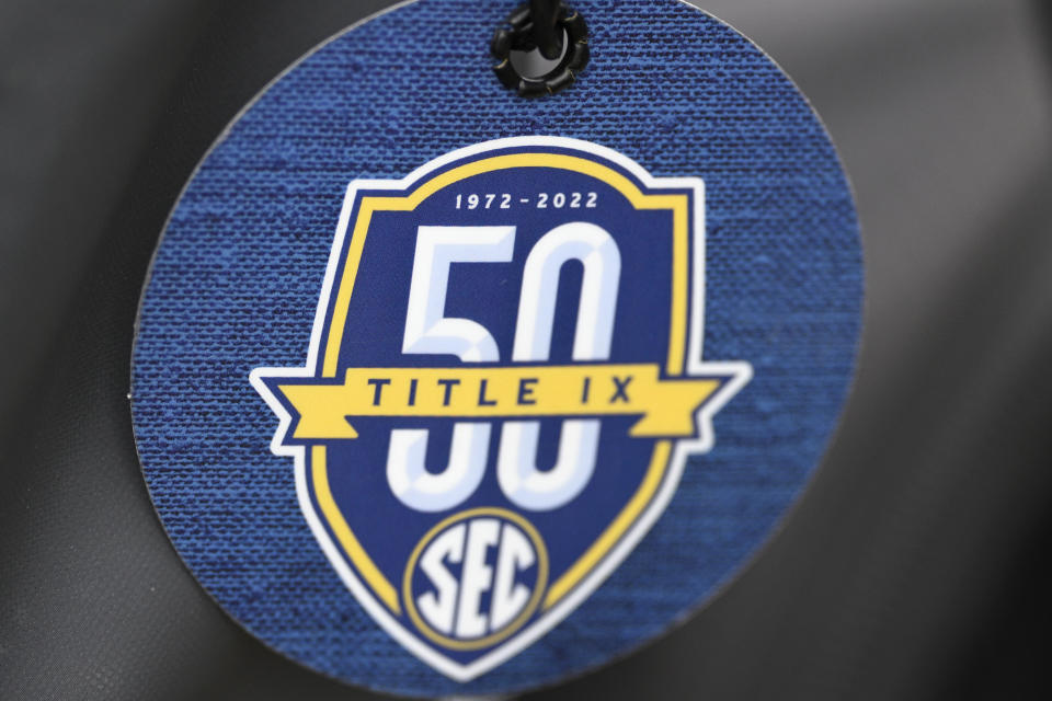 FILE - A luggage tag with a Southeastern Conference Title IX logo is viewed during an NCAA college softball game between South Carolina and Kennesaw State, March 1, 2024, in Orlando, Fla. Republican states are filing a barrage of legal challenges against the Biden administration's newly expanded campus sexual assault rules, saying they overstep the president's authority and undermine the Title IX anti-discrimination law. (AP Photo/Phelan M. Ebenhack, File)