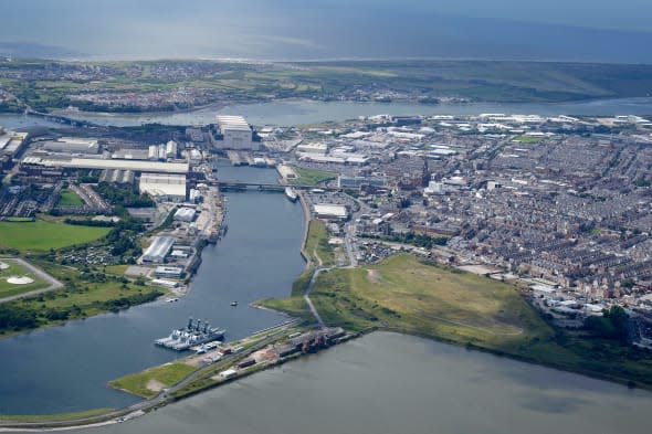 Barrow Docks and Ship Production Facility,  Barrow in Furness, North West England, with Walney Island behind