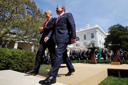 U.S. President Donald Trump (L) and Jordan's King Abdullah II leave after a joint news conference in the Rose Garden at the White House in Washington, U.S., April 5, 2017. REUTERS/Yuri Gripas