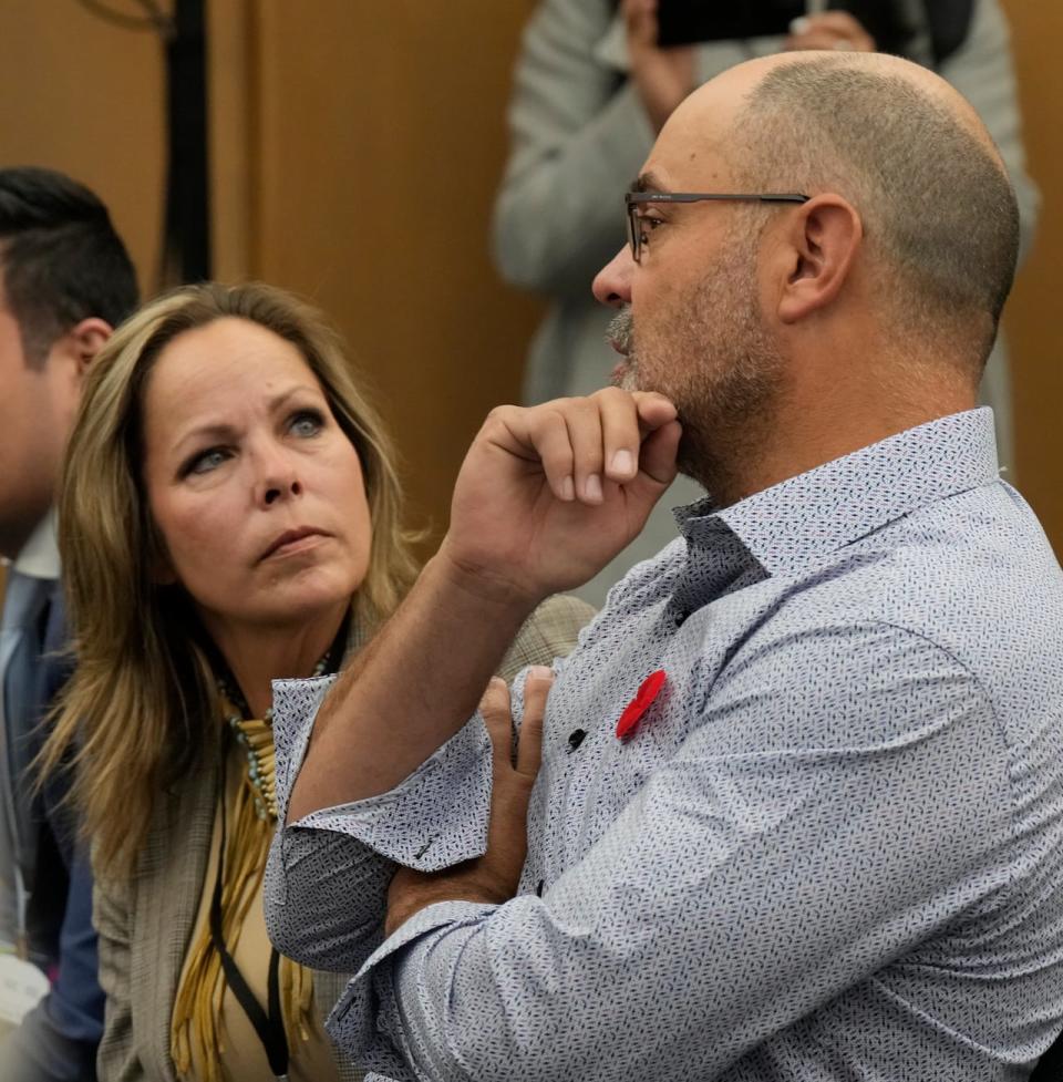 Freedom Convoy organizers Tamara Lich, left, and Chris Barber speak as they wait for the Public Order Emergency Commission to begin Nov. 1, 2022 in Ottawa.