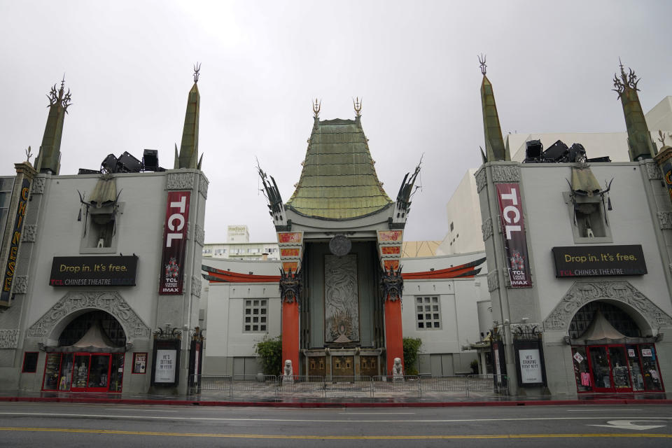 FILE - In this May 18, 2020, file photo, the TCL Chinese Theatre is shown with no people present in the Hollywood area of Los Angeles. Los Angeles County is expected to move Tuesday, May 4, 2021, into the least-restrictive yellow tier, amid the coronavirus pandemic. (AP Photo/Ashley Landis, File)