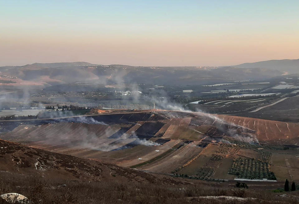 Smoke rises from Israeli army shells that landed in the southern Lebanese border village of Maroun Al-Ras, Lebanon, Sunday, Sept. 1, 2019. The Lebanese army says Israeli forces have fired some 40 shells on the outskirts of several border villages following an attack by the militant Hezbollah group on Israeli troops. (AP Photo/Mohammed Zaatari)